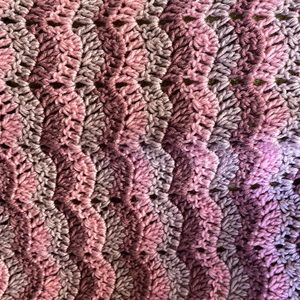 Beautiful Mauve, Plum and Pink Lap Blanket. Semi scalloped at 2 ends.
